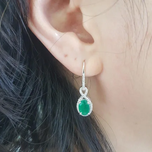 Vista 4 de Dazzlingrock Collection - Pendientes colgantes para mujer, diseño de infinito, color oro blanco