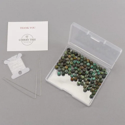 Vista 2 de Cherry Tree Collection 100 cuentas redondas de 6 mm de turquesa africana para hacer joyas Incluye caja de almacenamiento, cordón elástico