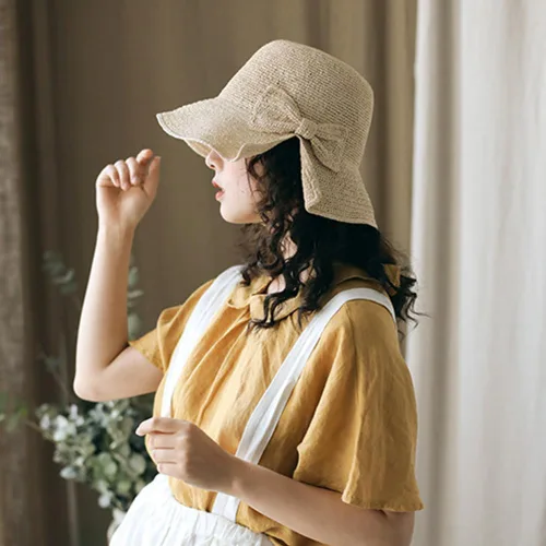 Vista 5 de Sombrero de playa plegable de ala ancha con paja, gorra de cubo de verano con lazo para mujeres y niñas Beige