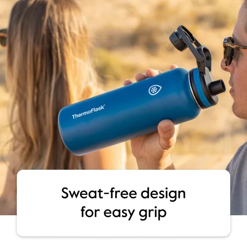 Vista 7 de Thermoflask - Botella de agua de acero inoxidable con doble aislamiento y dos tapas, 18 onzas, negro