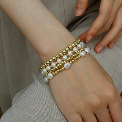 Vista 4 de Pulseras de cuentas de oro para mujer, perlas barrocas apilables, chapadas en oro de 14 quilates, pulsera de bolas elásticas para regalo de joyería