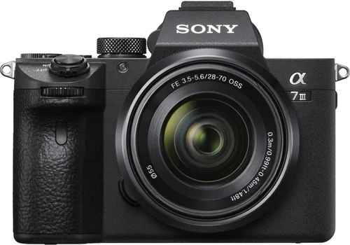 Vista 2 de Sony Cámara sin espejo a7 III con lente FE 1.102-2.756 in f/3.5-5.6 OSS + agarre inalámbrico Sony GP-VPT3 + tarjeta de memoria de 128 GB + luz LED +