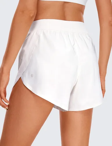 Vista 2 de CRZ YOGA Pantalones cortos de correr de delfín de cintura alta para mujer, de secado rápido, ligero, forro alto, pantalones cortos de entrenamiento