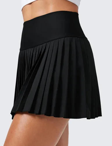 Vista 4 de CRZ YOGA Faldas de tenis plisadas de cintura alta para mujer con bolsillos, control de abdomen, forro casual, línea A, para entrenamiento y golf