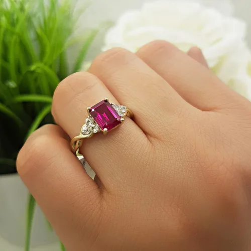 Vista 2 de Dazzlingrock Collection 8x6mm Emerald Shape Center Lab Created Ruby & 2.2mm Round White Sapphire on Side Crisscross Shank Engagement Ring for Her in