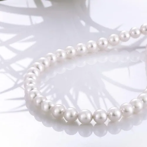 Vista 4 de Juego de collar y aretes de perlas de cristal, collar de perlas para mujer, conjunto de joyas de perlas sintéticas para mujer con cadena de encanto