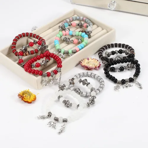 Vista 9 de Twinfree Pulseras bohemias para mujer, pulsera elástica de cuentas de colores multicapa con dije de joyería