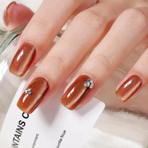 Vista 2 de AILLSA - Esmalte de uñas de gel ojo de gato color marrón con purpurina dorada con imán, esmalte de uñas de gel ámbar destello nude con cristales