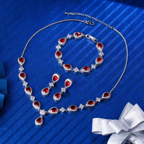 Vista 3 de EleQueen, juego nupcial de collar en V, pulsera tenis y aretes colgantes, con circonia cúbica, flor y lágrima, tono plateado, para mujer