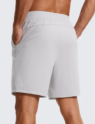 Vista 2 de CRZ YOGA Pantalones cortos de entrenamiento elásticos en cuatro direcciones para hombre, 7 pulgadas, suaves, duraderos, casuales, con bolsillos