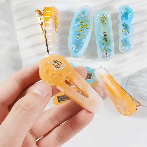 Vista 4 de Kit de 12 pinzas para el cabello Shaker - Horquilla de arena movediza moldes de resina epoxi pasadores de pelo de pata de gato, pinzas de silicona
