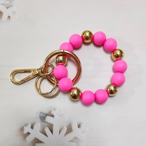 Vista 5 de Junyuerly Llavero de pulsera con cuentas de silicona para mujer, pulsera elástica con clip dorado