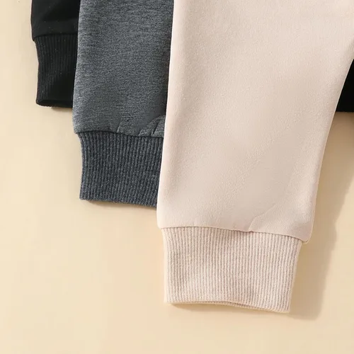 Vista 6 de Paquete de 3 pantalones deportivos básicos lisos y suaves de algodón de color liso, pantalones de algodón para otoño e invierno