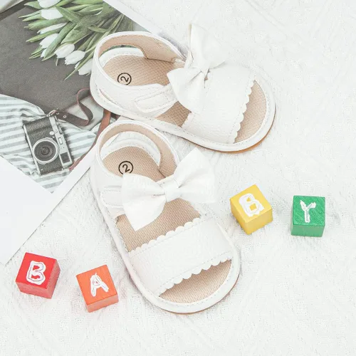 Vista 5 de Sandalias para bebé niña, suela de goma antideslizante suave, sandalias casuales de playa para recién nacidos, con lazo, zapatos de verano