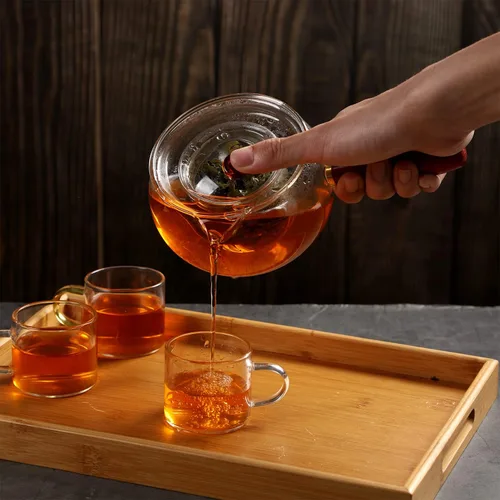 Vista 5 de WHJY Tetera de vidrio con infusor para té suelto, pequeña tetera mágica transparente para estufa, tetera japonesa transparente con mango de madera