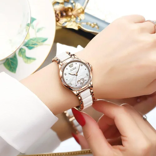 Vista 2 de OLEVS Relojes de oro rosa para mujer, relojes automáticos con pulsera de cerámica de acero inoxidable de dos tonos, relojes de cuerda automática