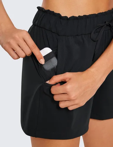 Vista 4 de CRZ YOGA Pantalones cortos deportivos elásticos en 4 direcciones para mujer, de cintura alta, cómodos pantalones cortos casuales de trabajo