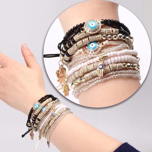 Vista 2 de Budsmile Pulseras bohemias de cuentas elásticas para mujeres y niñas, juego de pulseras apilables en múltiples capas, dijes multicolor hechos a