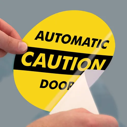 Vista 4 de SmartSign, calcomanía para vidrio de doble cara con leyenda "Caution: Automatic Door 2-Sided Message", círculo de 6 pulgadas de diámetro