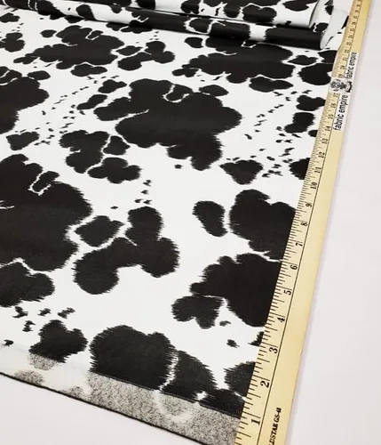 Vista 2 de Tapicería de vinilo con textura en relieve, piel falsa con estampado de vaca, 54 pulgadas de ancho, vendido por The Yard (negro)