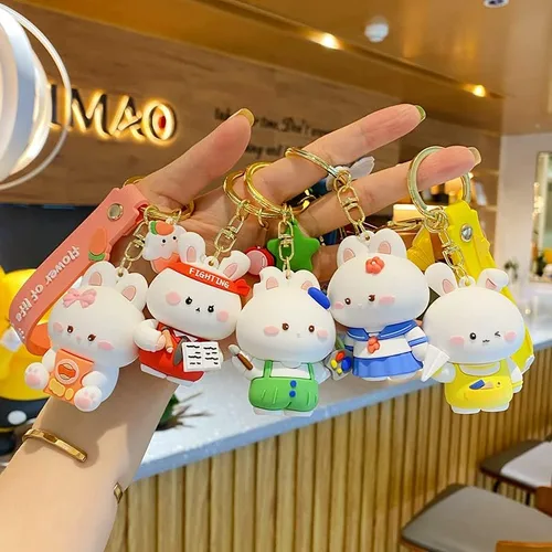 Vista 3 de BEXOA Lindo llavero de regalo de Navidad Llavero de conejo Kawaii de Año Nuevo para niños y niñas, mochila con dijes para mujeres y hombres
