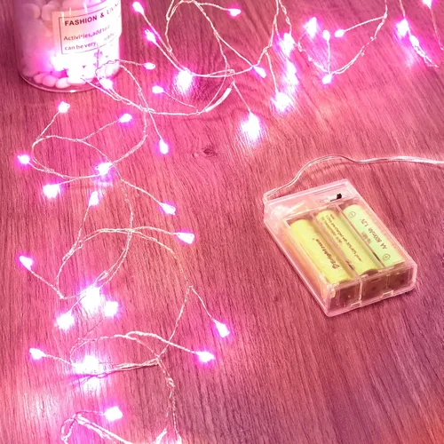 Vista 9 de Luces de hadas que funcionan con pilas, luces de cuerda centelleantes impermeables con cable plateado de 5 pies y 60 LED, luces de fuegos