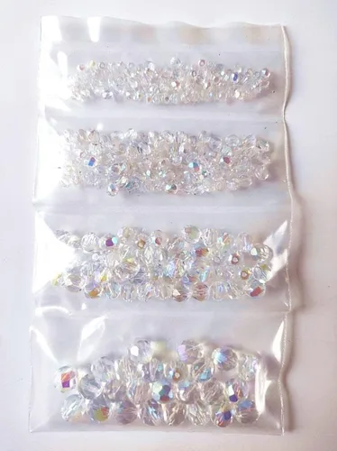 Vista 4 de Juego de cuentas de cristal checo pulido al fuego en color cristal AB para la fabricación de joyas y manualidades - diferentes tamaños 0.118 in