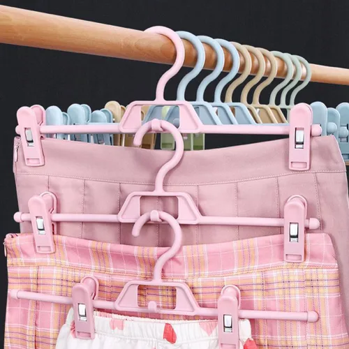 Vista 3 de DOITOOL Paquete de 10 perchas antideslizantes rosas para pantalones con clips ajustables, clips de plástico retráctiles para el hogar