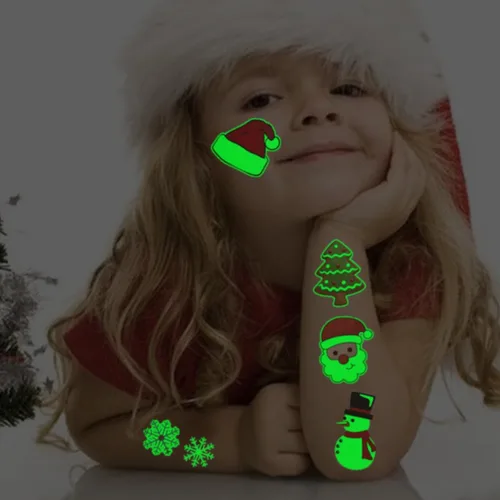 Vista 4 de CHARLENT Tatuajes temporales de Navidad que brillan en la oscuridad para suministros de fiesta de niños, 74 hojas individuales, tatuajes luminosos