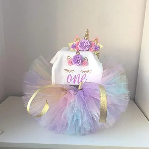 Vista 2 de TTYAOVO - Conjunto de 3 piezas para el primer cumpleaños del bebé, con estampado de unicornio, con diadema, mameluco y falda