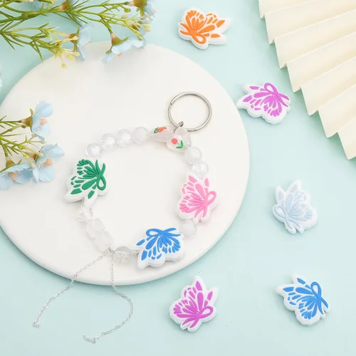 Vista 5 de CHGCRAFT 12 cuentas focales de silicona, 6 colores, cinta de mariposa, cuentas espaciadoras para hacer llaveros, pulseras, collares, manualidades