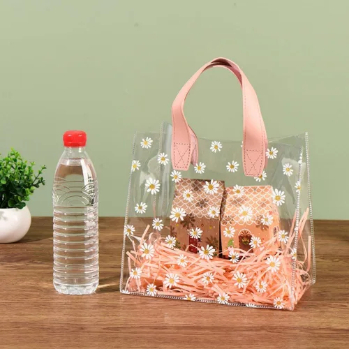 Vista 4 de YMASELA Bolsa de regalo transparente con asas (9.8 x 9.1 x 5.5 pulgadas, 2 unidades) bolsa de embalaje de regalo impermeable de plástico resistente