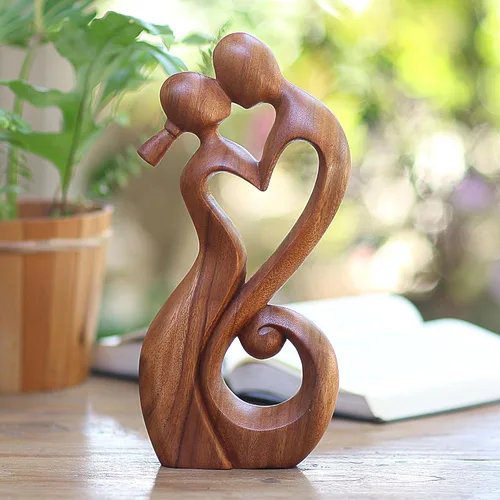 Vista 2 de NOVICA Escultura romántica de madera de suar marrón, 11.75 pulgadas de alto 'Everlasting Kiss