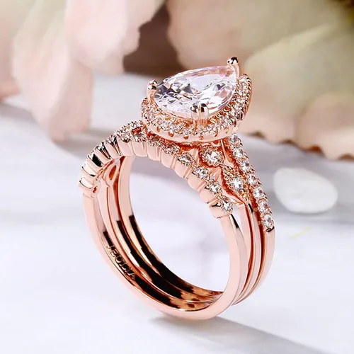 Vista 5 de Jeulia Juego de anillos de boda en forma de pera 3 piezas de plata de ley con corte de pera de halo de diamantes de oro rosa, anillo de boda