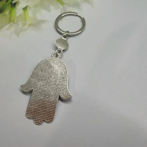 Vista 5 de UQUABESO Llavero Hamsa de cristal de ojo malvado, dije de diamantes de imitación, llavero de mano de Fátima para bolso, bolso, llavero de buena