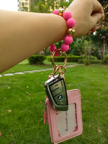 Vista 9 de Junyuerly Llavero de pulsera con cuentas de silicona para mujer, pulsera elástica con clip dorado