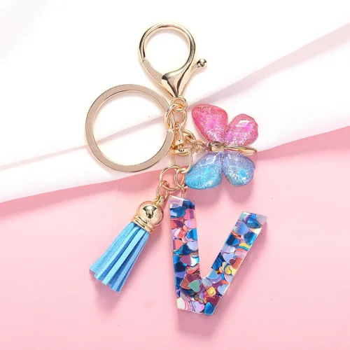 Vista 2 de Llavero de letra inicial del alfabeto de moda, borla y mariposa, llavero para bolso, bolsos de mano para mujeres y niñas