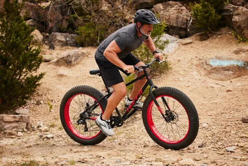 Vista 5 de Huffy Bicicletas de montaña para hombres, tamaños de 26/27.5 pulgadas, múltiples velocidades, suspensión disponible, opción de neumático grueso
