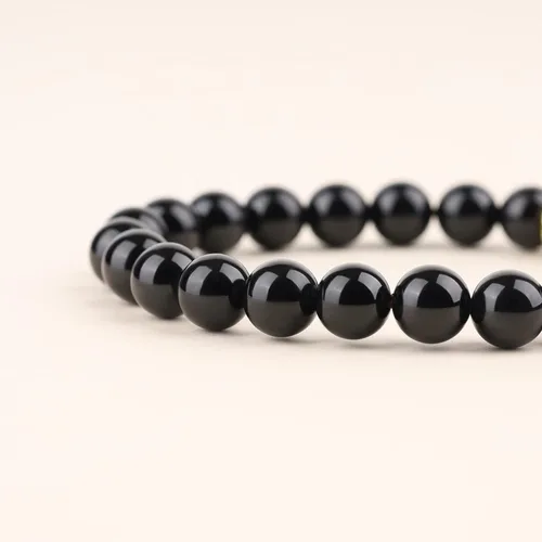 Vista 4 de COAI Pulsera de piedra turmalina negra con encanto de loto para mujer
