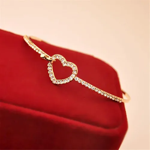 Vista 6 de JUNYY Delicada pulsera con dije de corazón hueco de diamantes de imitación para mujeres y niñas, pulsera de fiesta de cumpleaños (dorado)