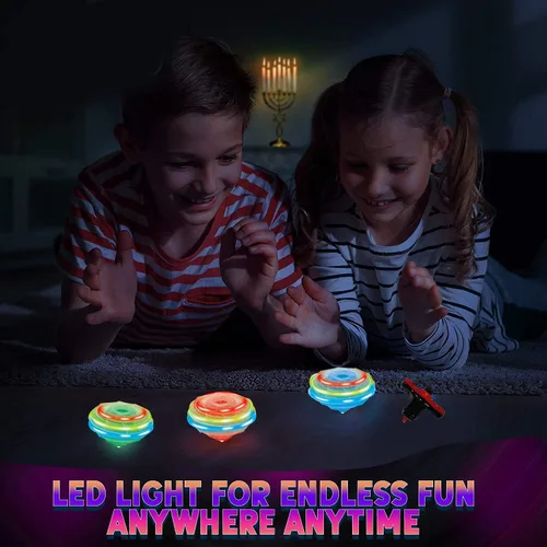 Vista 5 de Paquete de 12 tops giratorios iluminados – Tops giratorios OVNI con giroscopio, juguete LED intermitente a granel, recuerdos de fiesta novedosos