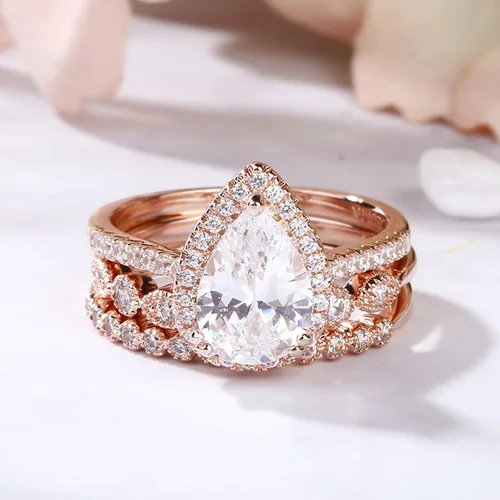 Vista 6 de Jeulia Juego de anillos de boda en forma de pera 3 piezas de plata de ley con corte de pera de halo de diamantes de oro rosa, anillo de boda