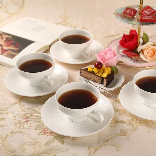 Vista 3 de Juego de taza de té y platillo de porcelana fina, superficie de escultura, taza ligera de 7 onzas, juego de cuatro