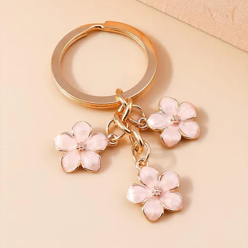 Vista 4 de Homvog 4 llaveros de flores lindos para mujer, llaveros de flores, dijes de borlas, colgantes esmaltados, llavero de borla, regalo de cartera