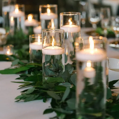 Vista 3 de Velas flotantes blancas de 6 horas, velas de cera de agua de piscina pequeñas sin perfume de 2 pulgadas para jarrón cilíndrico, centro de mesa