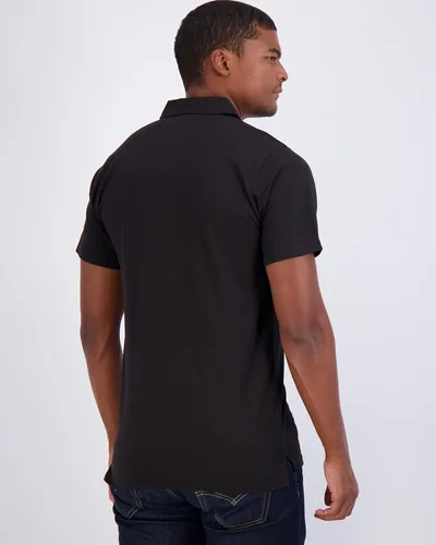 Vista 44 de Real Essentials Paquete de 3: Polo de manga corta de algodón para hombre, de secado rápido, transpirable, (disponible en tallas grandes y altas)