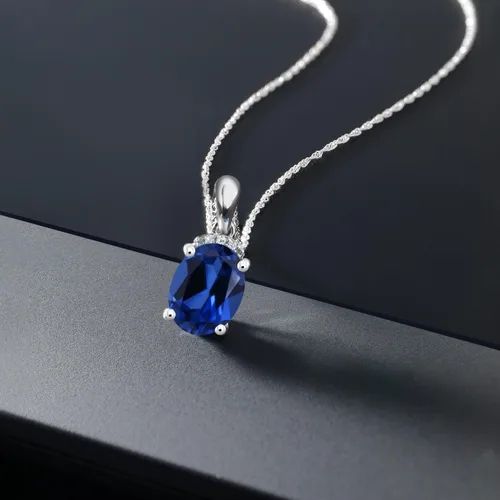 Vista 5 de Gem Stone King Colgante de oro blanco de 10 quilates con zafiro de imitación azul ovalado de 2,32 quilates