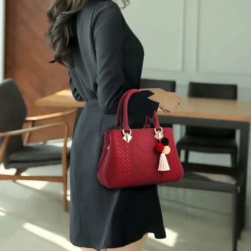 Vista 3 de Bolso de mano de cuero para mujer, bolso de hombro con asa superior, con pompón y borla