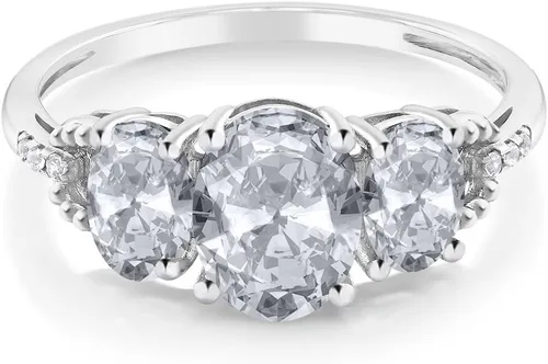 Vista 8 de Anillo de compromiso ovalado de oro blanco de 10 quilates con piedra natal y topacio blanco de 3 piedras con detalles de diamante Centro de 0.315