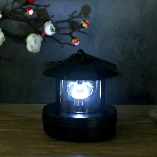 Vista 2 de HAKUNA Faro LED alimentado por energía solar, lámpara giratoria de 360 grados, impermeable, estatua giratoria para jardín, patio, decoración al aire